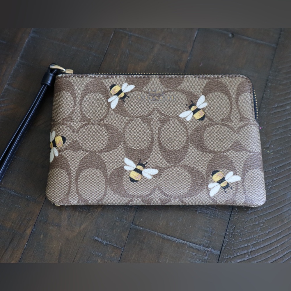 Coach Tan Wristlet with Bee Design